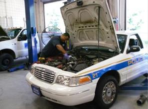 Employee working on a car.