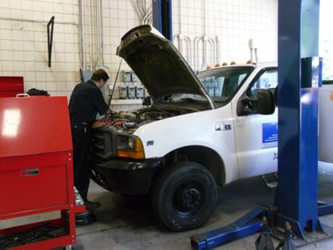 Employee working on a car.